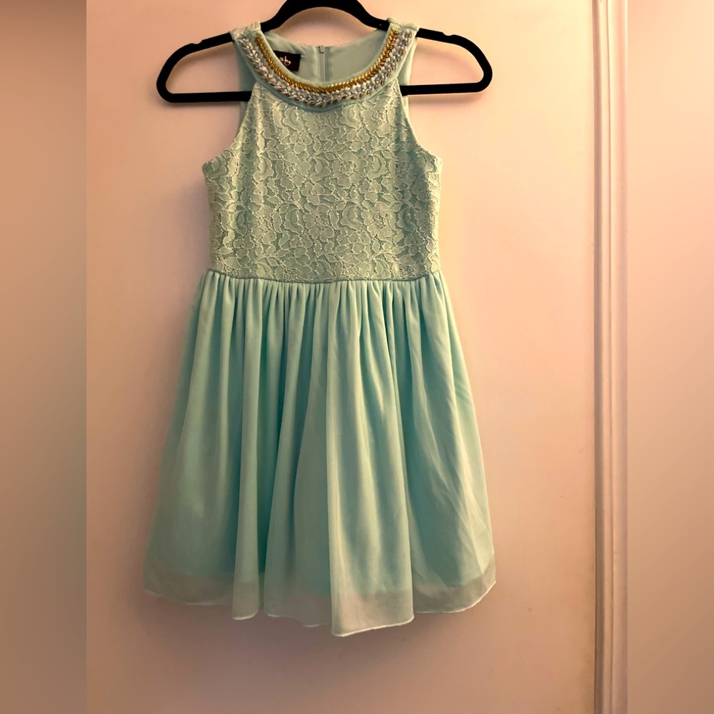 This by&by light greenish, blue sleeveless dress can be formal or casual wear.